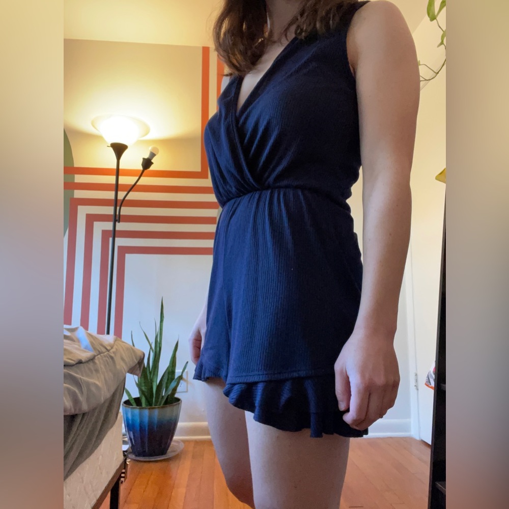 Royal blue ribbed romper, deep v-neck. 95% polyester, 5% spandex.